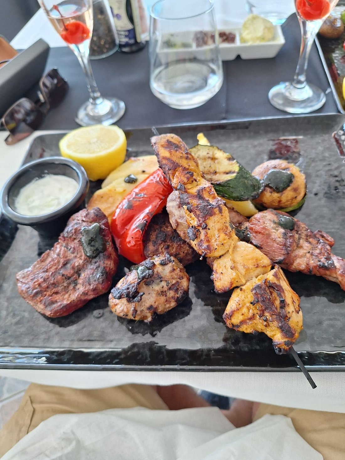 Mixed grill platter with skewers, steak and grilled vegetables